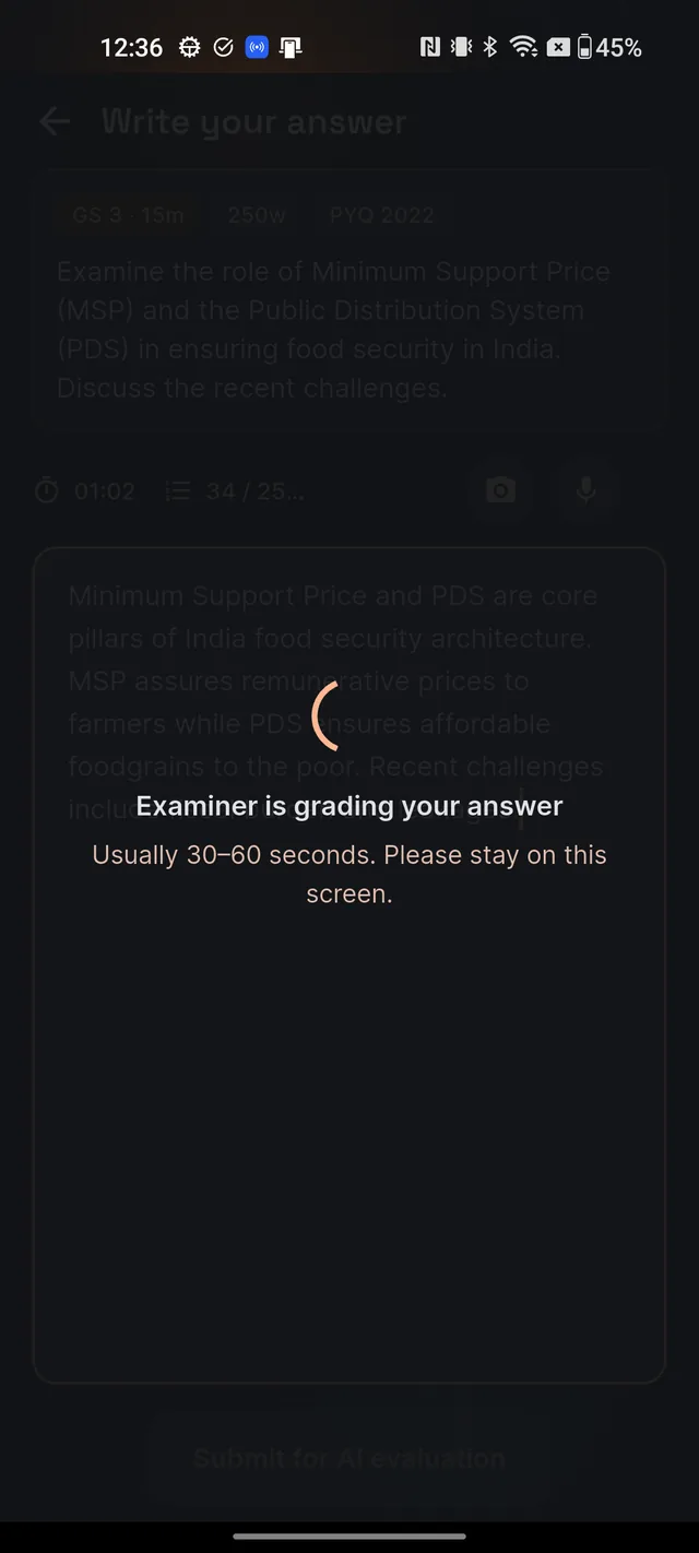 Full-screen overlay over the editor reading Examiner is grading your answer, usually 30 to 60 seconds, please stay on this screen